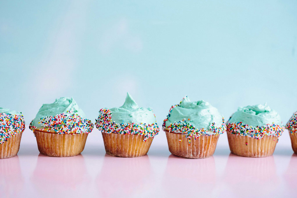blue frosted cupcakes with sprinkles